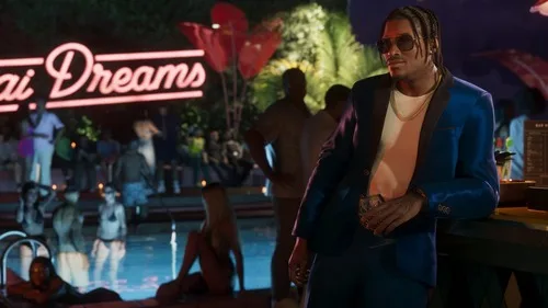 Dre'Quan Priest at a pool party beneath a neon sign, from official GTA 6 material